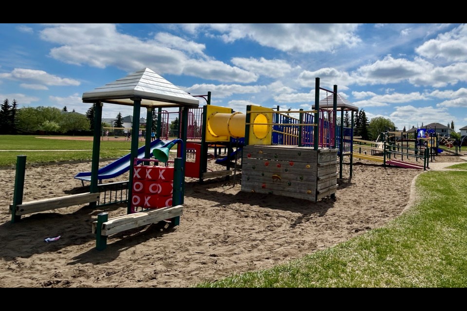 Playground at J. J. Nearing Catholic Elementary School. The tops of the playground structures used to be bright yellow and red. 
